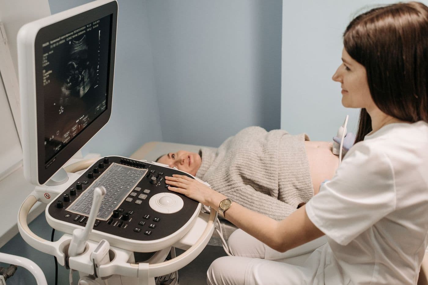 An ultrasound scan in progress, with the image on the monitor